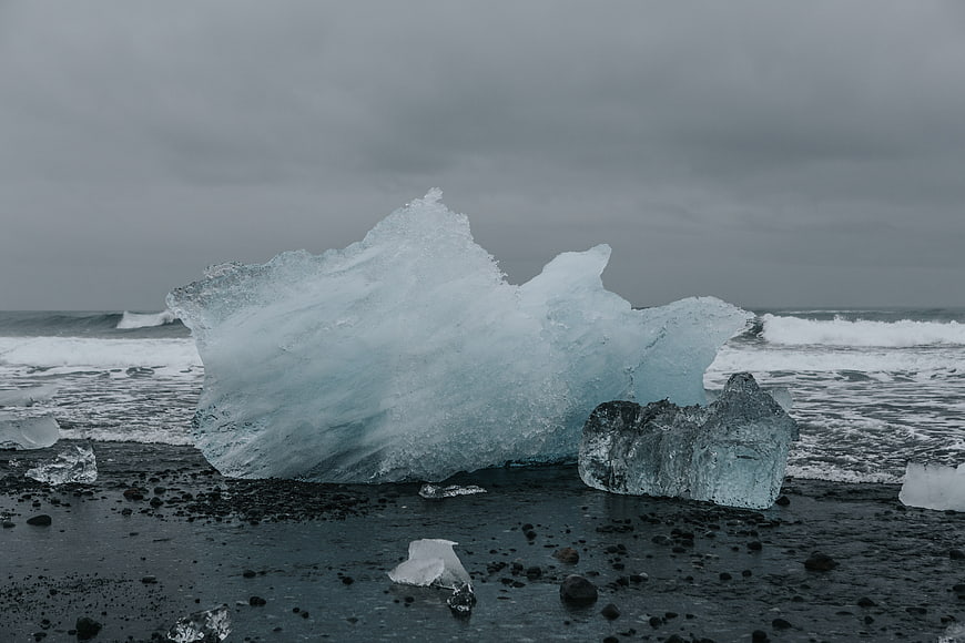 Large Blue Glacier Ice Chunk on Black Sand Beach