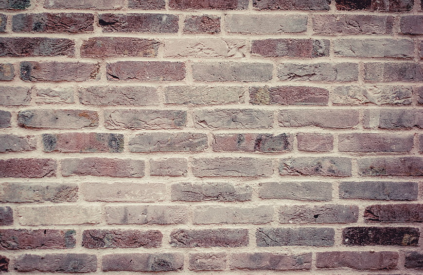 Textured Old Brick Wall Background in Brown and Grey