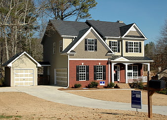 New Construction House with Red Brick and Beige Siding