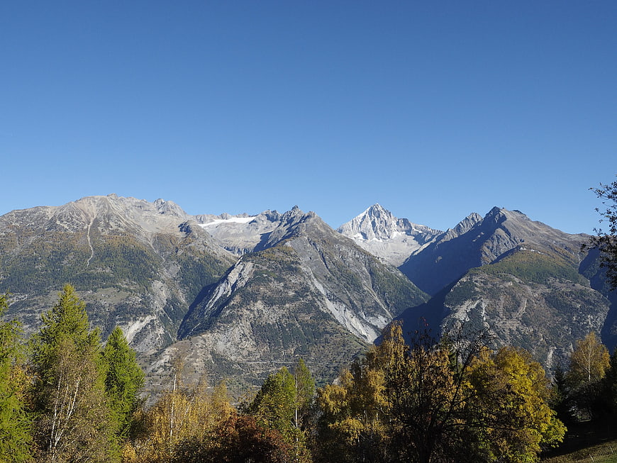 Majestic Swiss Alps Mountain Range with Autumn Forest