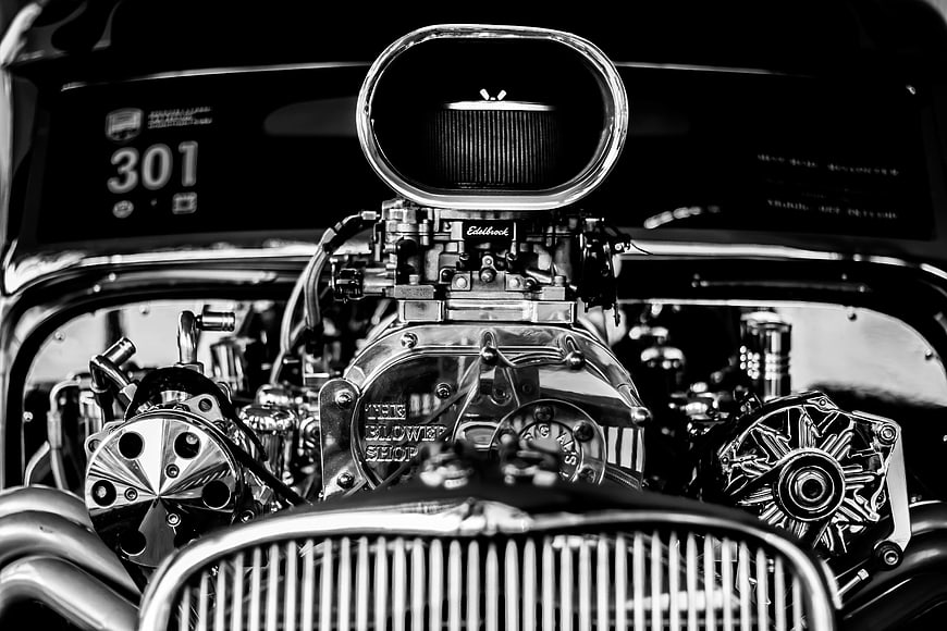 Black and white close-up of a classic hot rod engine