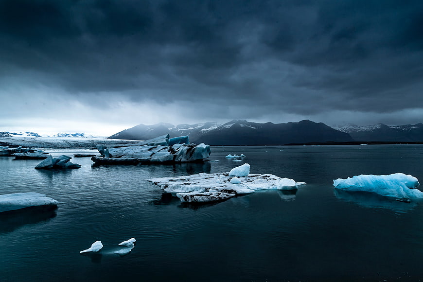 Dramatic Glacial Lagoon with Icebergs and Mountains