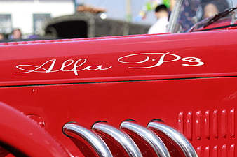 Close-up of red vintage Alfa P3 car hood with chrome details