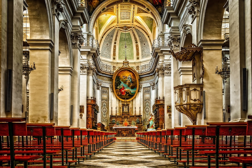 Interior of Baroque Church with Dome and Red Pews
