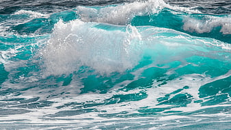 Turquoise Ocean Wave Breaking With White Sea Foam And Splash