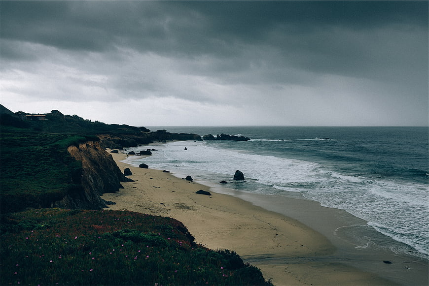 Dramatic Coastal Landscape with Stormy Sky and Sandy Beach