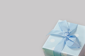 Blue gift box with ribbon on white background