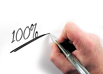 Hand writing 100 percent on white paper with pen