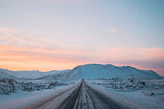 Snowy Mountain Road at Sunset with Pink Sky