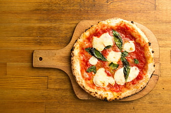 Fresh Margherita Pizza on Wooden Board Top View