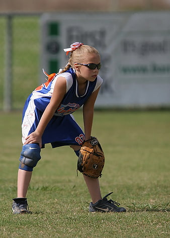 Young Girl Softball Player in Ready Stance on Field
