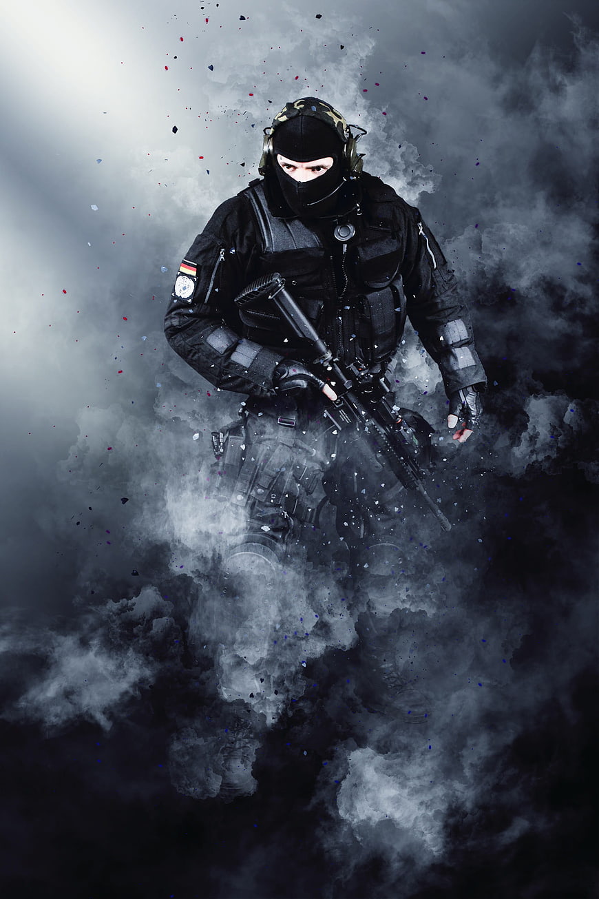 Special Forces Soldier in Tactical Gear Amidst Smoke