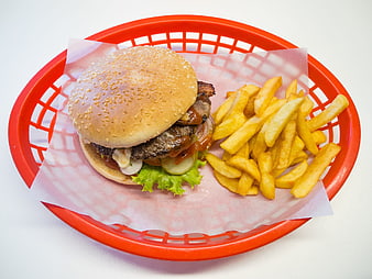 Cheeseburger with French Fries in Red Plastic Basket