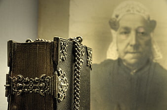 Antique leather bible with silver chains and vintage portrait