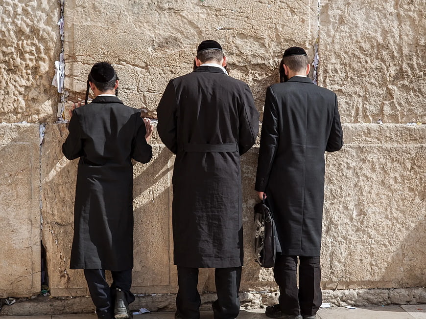 Three Hasidic Jews Praying at the Western Wall