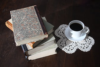 Vintage Books and Coffee on Dark Wooden Table