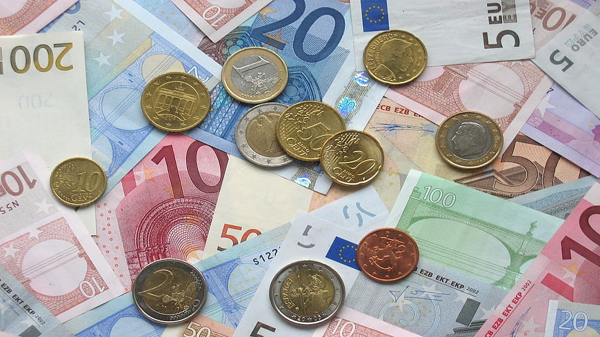 Scattered Euro Banknotes and Coins Flat Lay Background