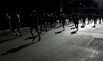 Silhouettes of Marathon Runners in Black and White
