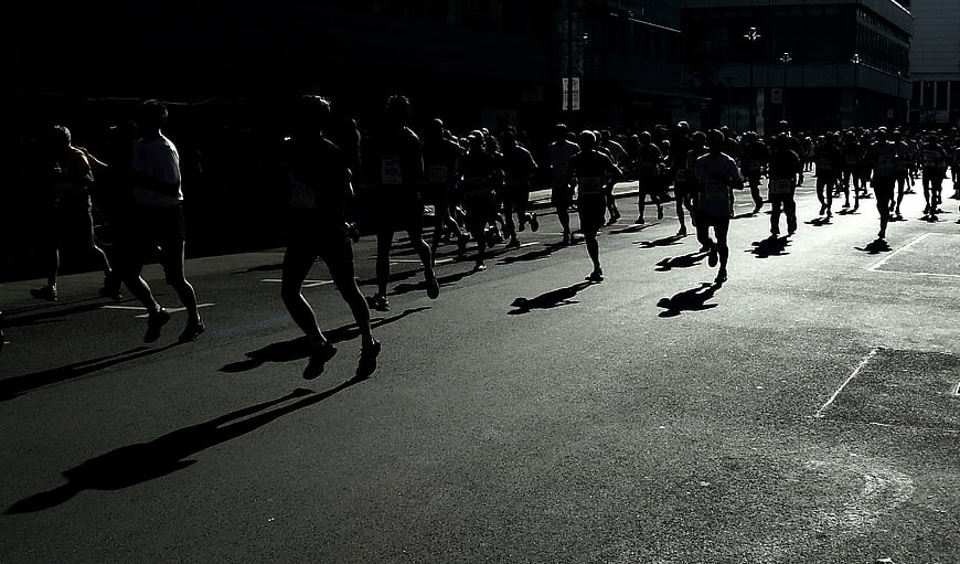 Silhouettes of Marathon Runners in Black and White