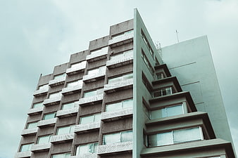 Low angle view of modern brutalist apartment building