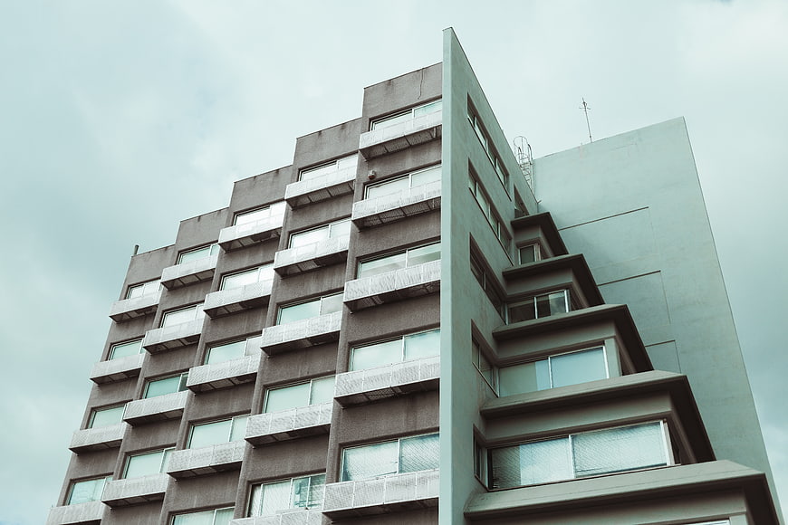 Low angle view of modern brutalist apartment building