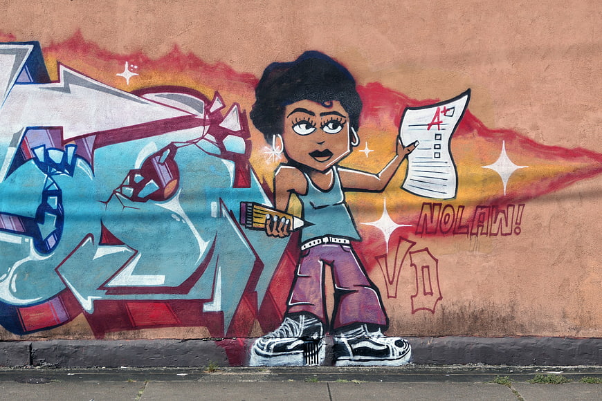 Colorful Street Art Mural of Student with A+ Paper
