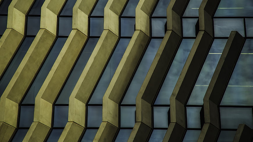 Modern Geometric Building Facade with Diagonal Concrete Beams