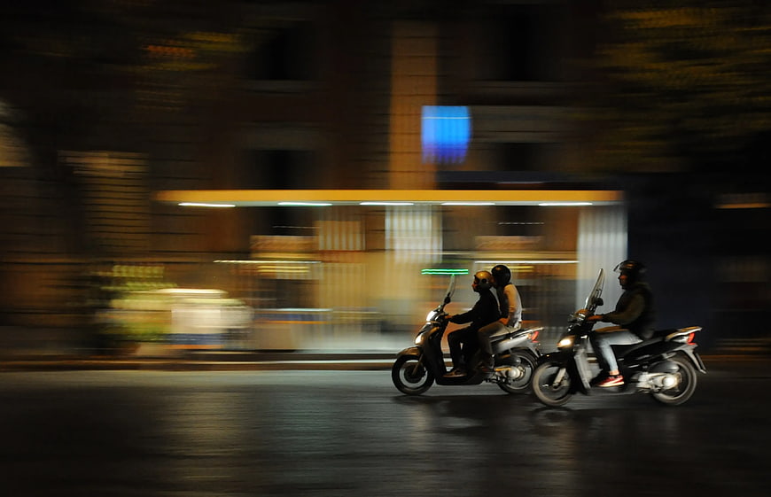 Motion Blur Scooters Riding at Night