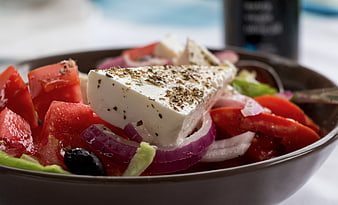 Close-up of fresh Greek salad with feta cheese and tomatoes