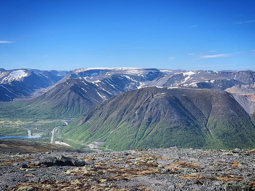 Scenic Mountain Landscape with Snow-Capped Peaks and Green Valley