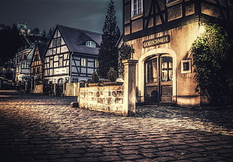 Historic German Cobblestone Street With Traditional Timber Frame Architecture
