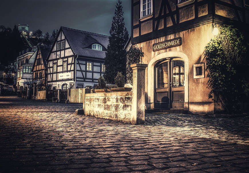 Historic German Cobblestone Street With Traditional Timber Frame Architecture