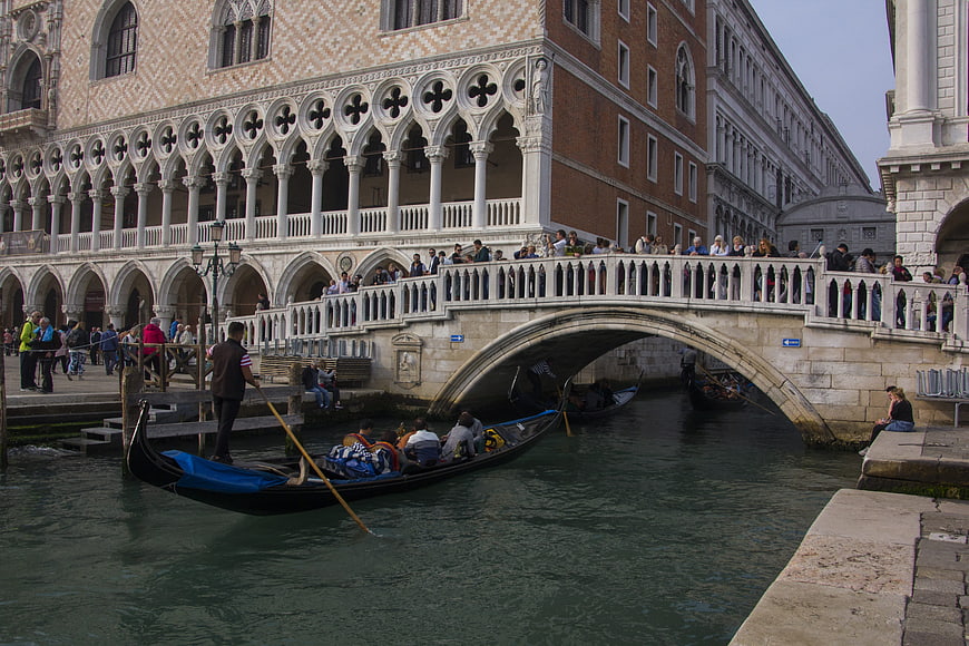 Gondola passing under Bridge of Sighs in Venice, Italy
