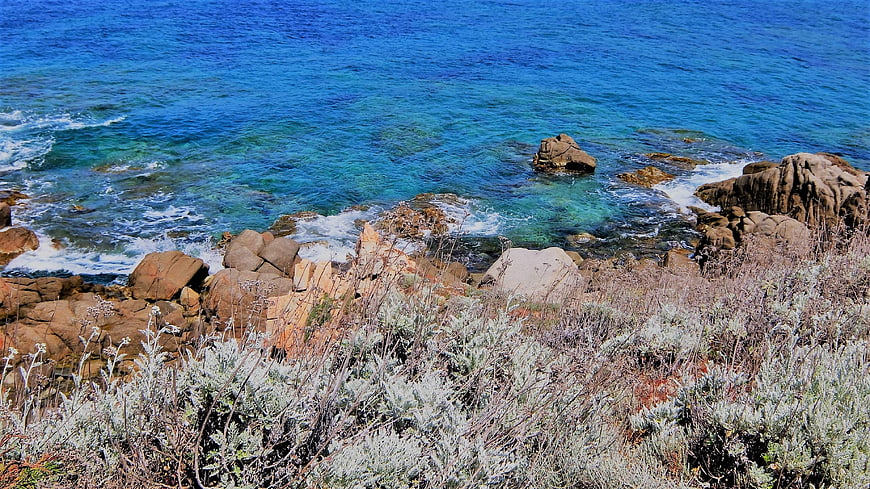 Aerial View of Rocky Coastline with Turquoise Ocean Water
