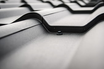 Close-up of black roof tiles with shallow depth of field