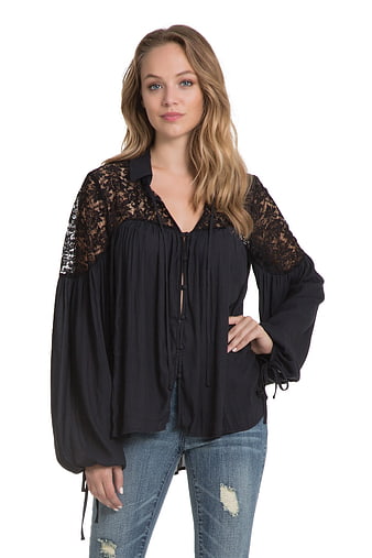 Woman in Black Lace Blouse and Jeans