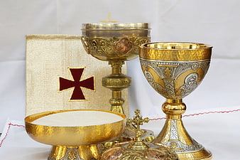 Gold Communion Chalice, Paten, and Cross on White Cloth