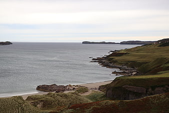 Scenic Scottish Highlands Coastline with Sandy Beach and Ocean