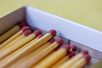 Close-up of wooden matches in a cardboard box