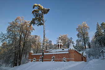 Snow-covered Orthodox Church in Winter Forest