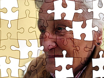 Senior woman face with missing puzzle pieces concept
