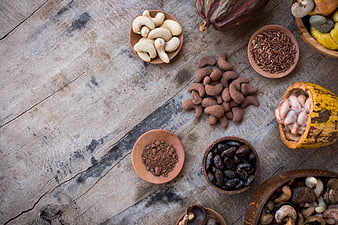 Top View of Cacao, Cashews, and Cocoa on Rustic Wood