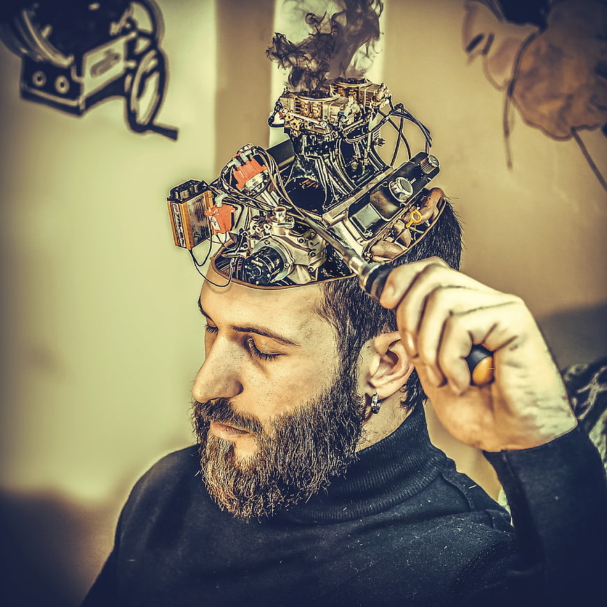 Man with mechanical brain concept and smoke