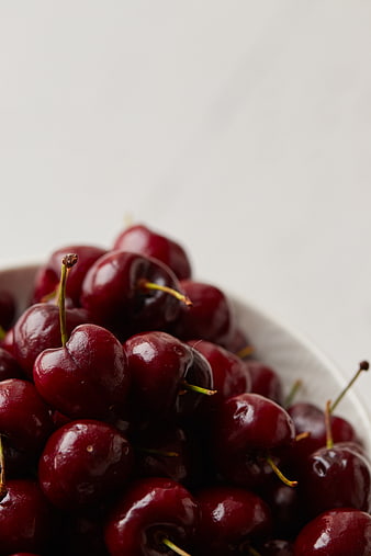 Fresh Red Cherries in White Bowl with Copyspace