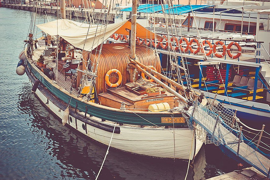 Classic Wooden Sailing Boat Docked in Harbor