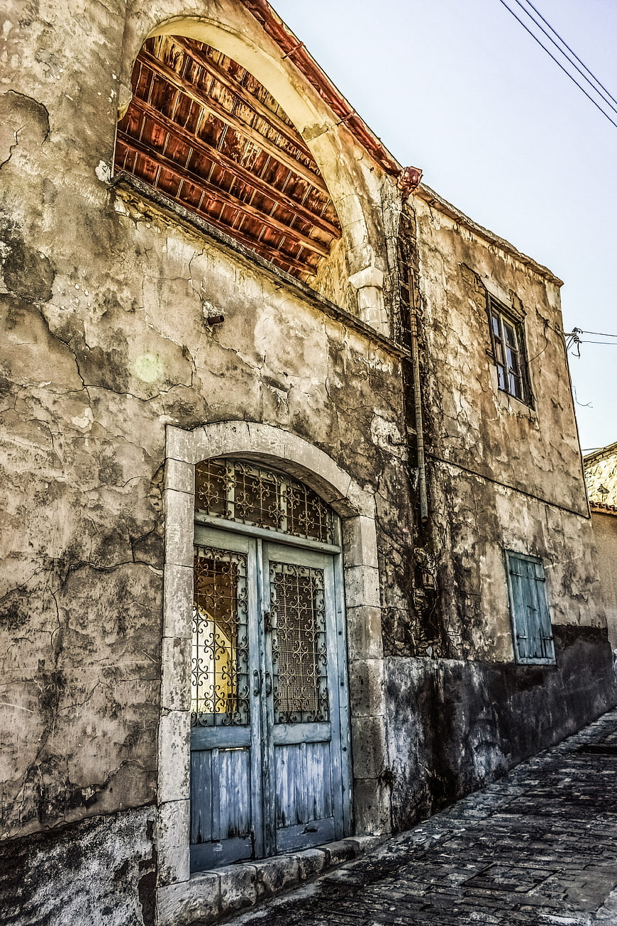 Weathered Old Building with Blue Door in Cyprus