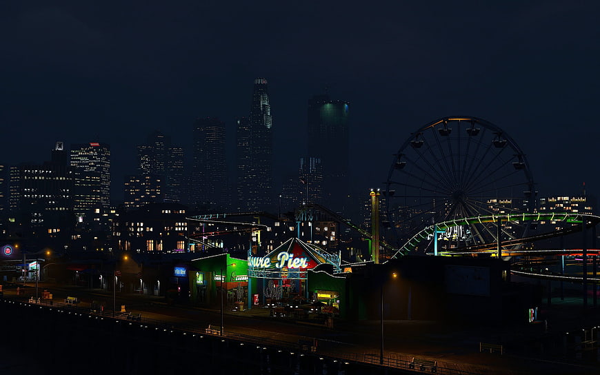 Night view of Santa Monica Pier and Los Angeles skyline