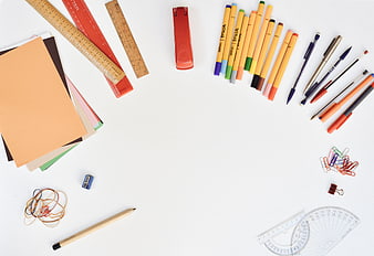 Flat lay of colorful school supplies and stationery on white background