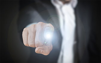 Businessman hand touching glowing digital interface button