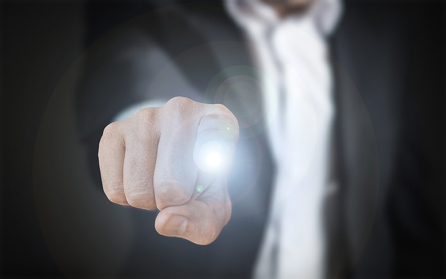 Businessman hand touching glowing digital interface button